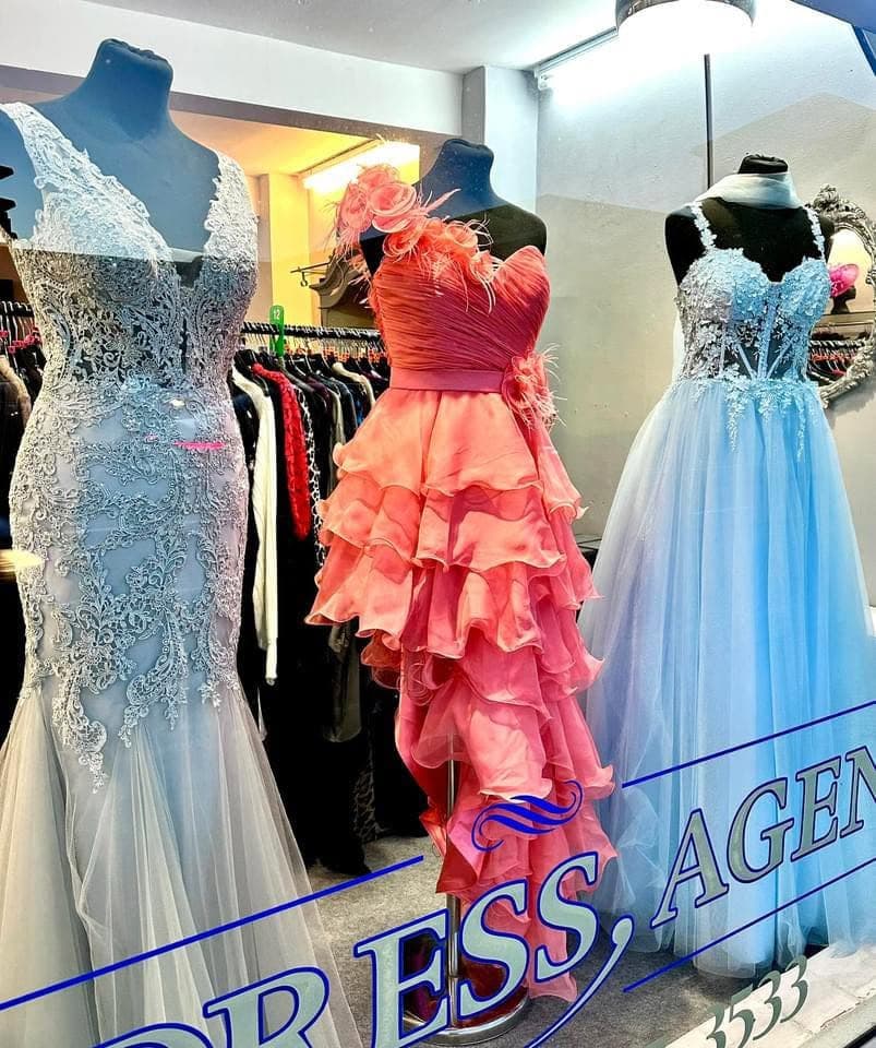 Window display of occasion and prom dresses at The Dress Agency in Hazel Grove
